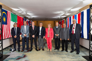 8 People Standing Next to Flags