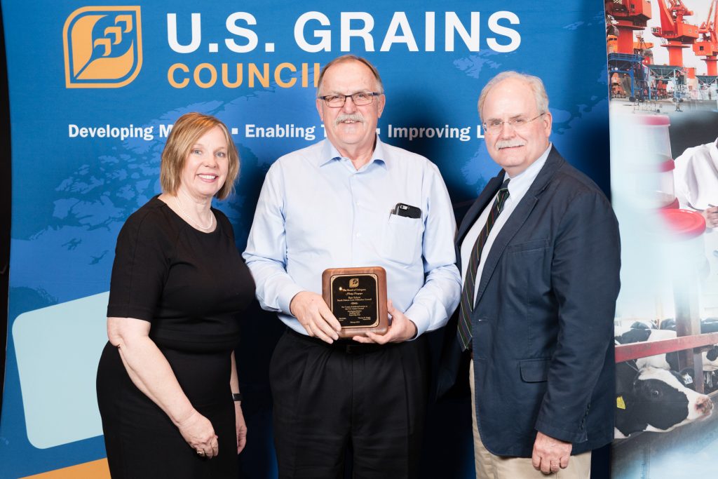 A man receiving a plaque