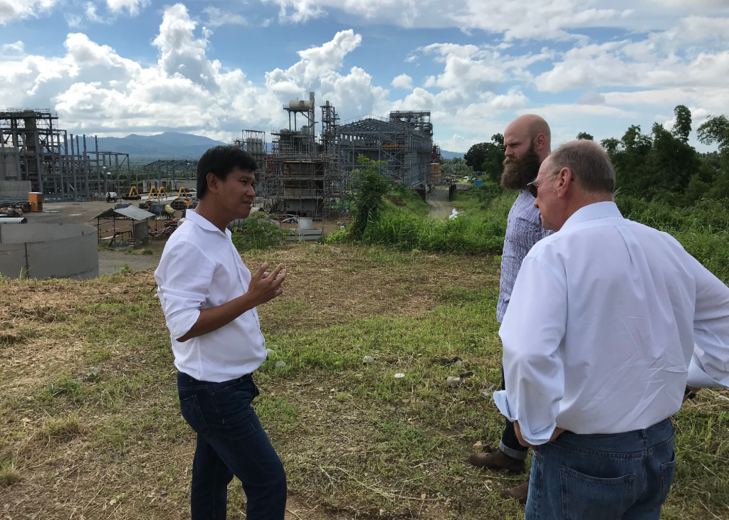 image of three men visiting ethanol plants in the Philippines