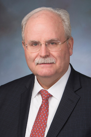 Man in front of Blue Background