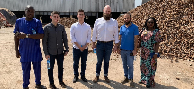 Six People Standing Next to Rumble