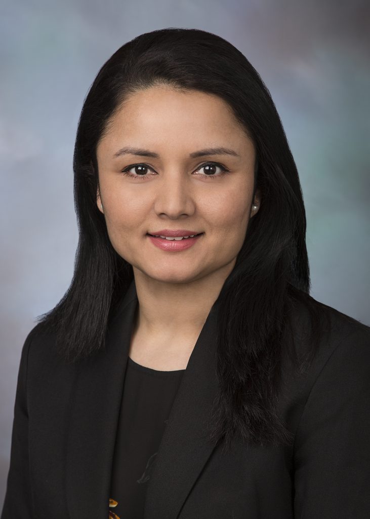 headshot of a woman with black hair