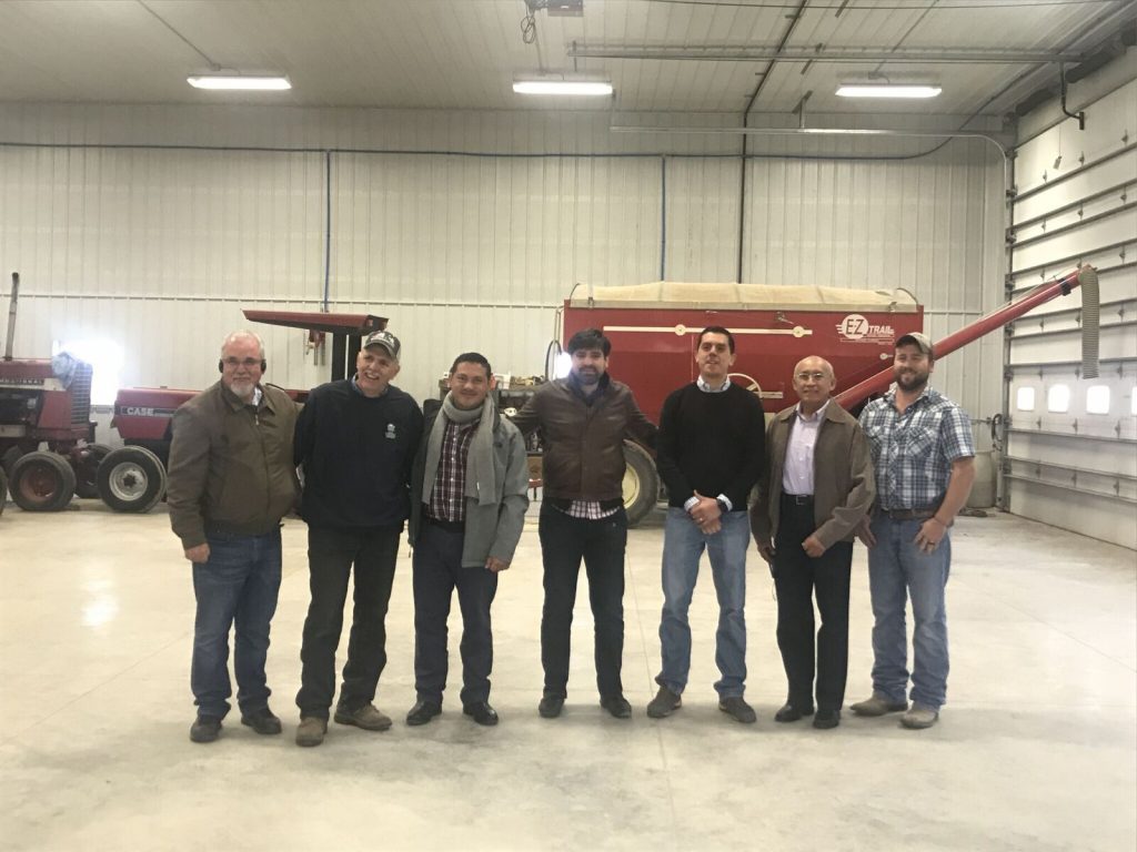 Mexico ExEx Team- team members standing in warehouse