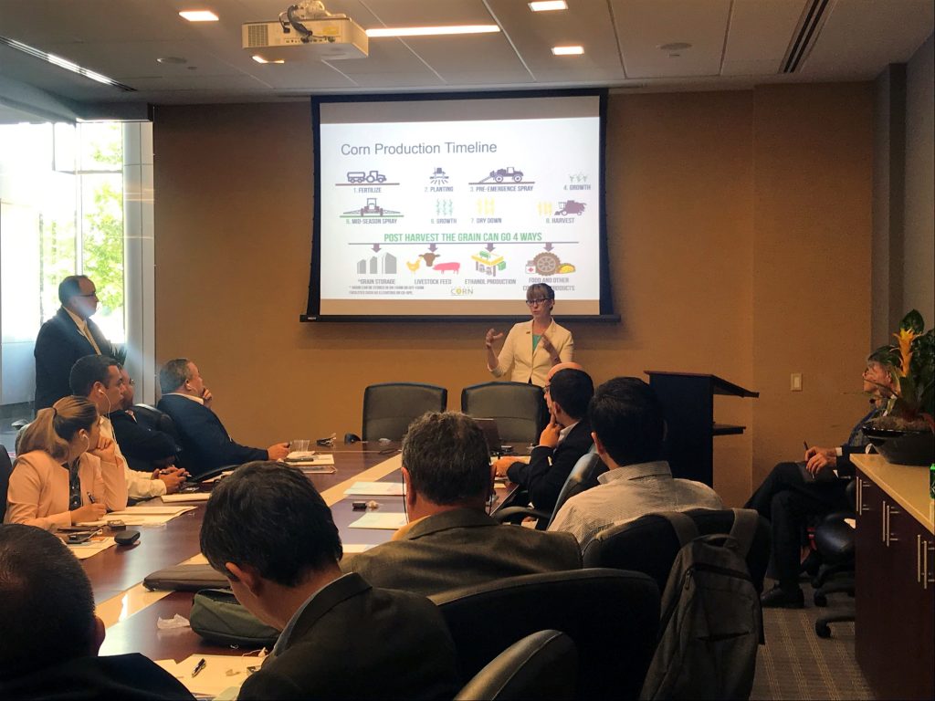 2019_07_LTA Ethanol Team- team seated in a meeting listening to a woman present in front of a screen