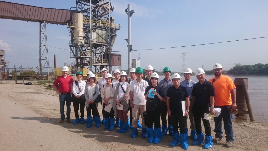 Japan Biotech Team- group photo of team standing at a plant