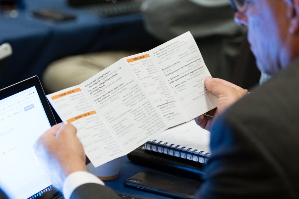 Cincinnati meeting agenda, close up picture of an attendee holding the agenda
