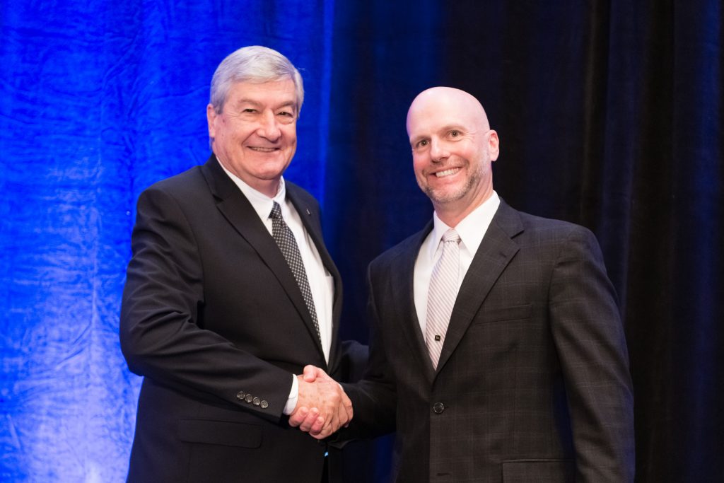 USGBC Past Chairman Jim Stitzlein and USGBC Chairman Darren Armstrong shaking hands