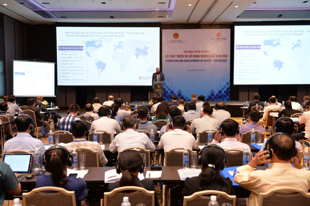 Vietnam Biofuels Conference, aerial view of the audience and man on stage standing behind a podium speaking