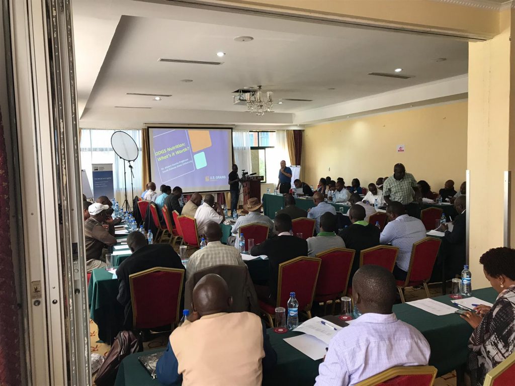 East Africa Trade Servicing- man peaking at podium to a crowd of attendees