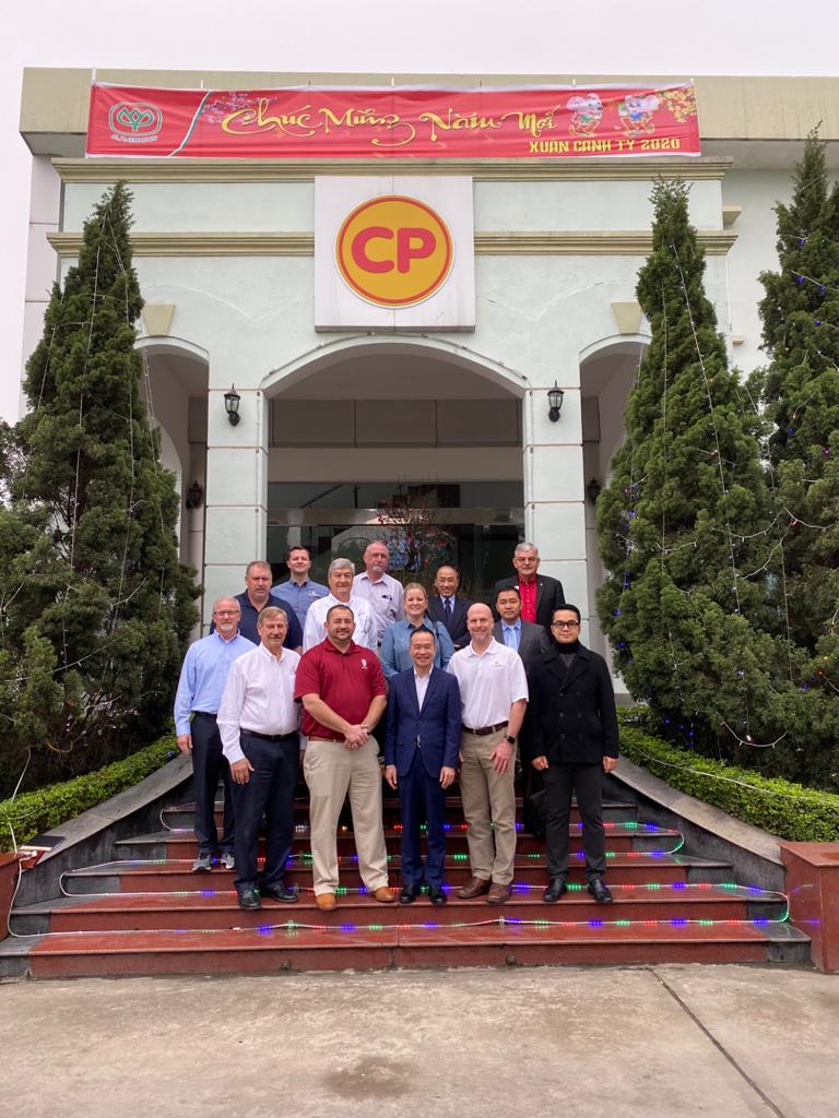 a group of people smiling for a photo in Vietnam