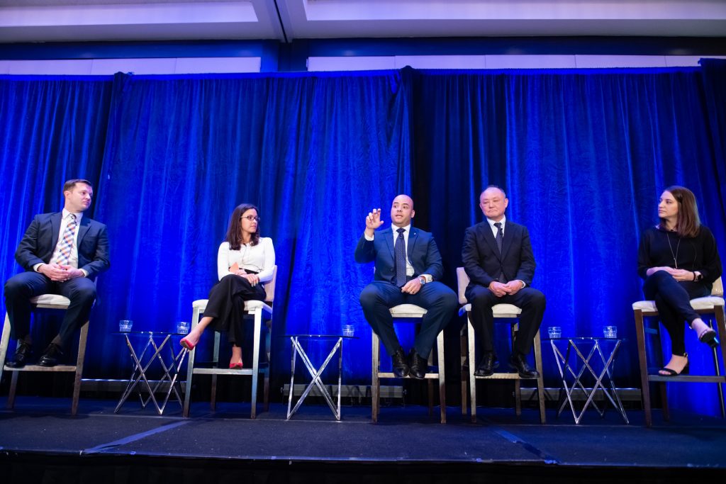 5 People Sitting on Stage