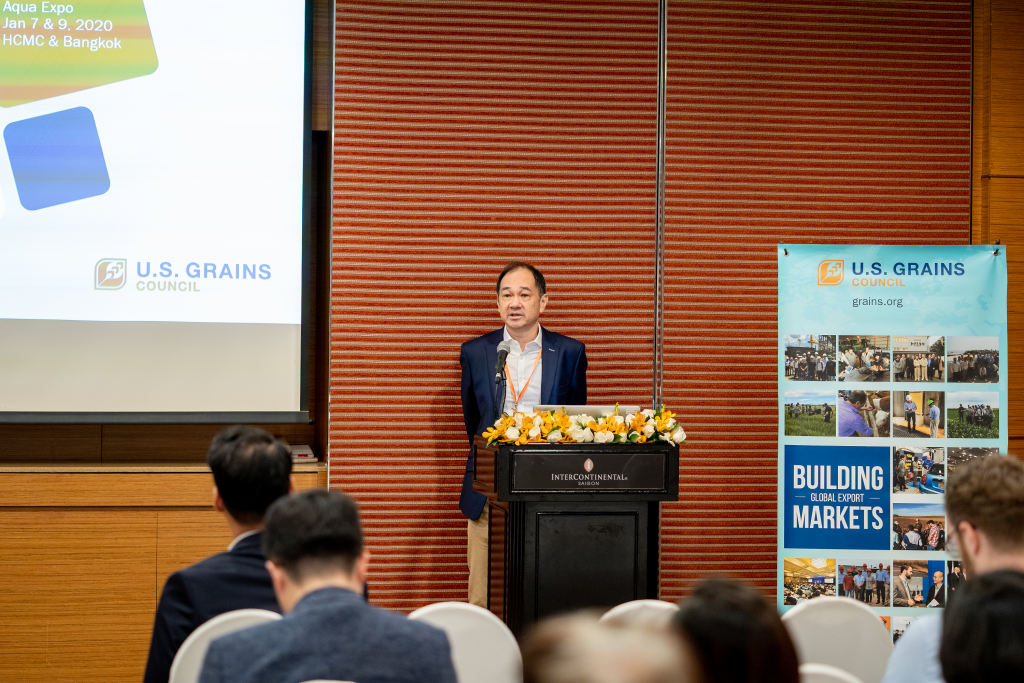 Man Talking at Podium