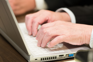 Two Hands Typing on Laptop