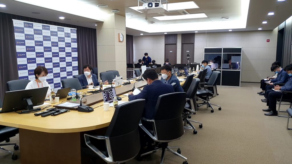 People Sitting Around Desk