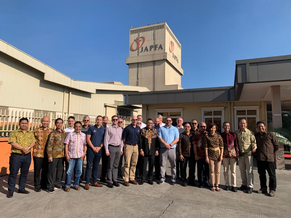 People Standing For Picture In Front of JAPFA Building