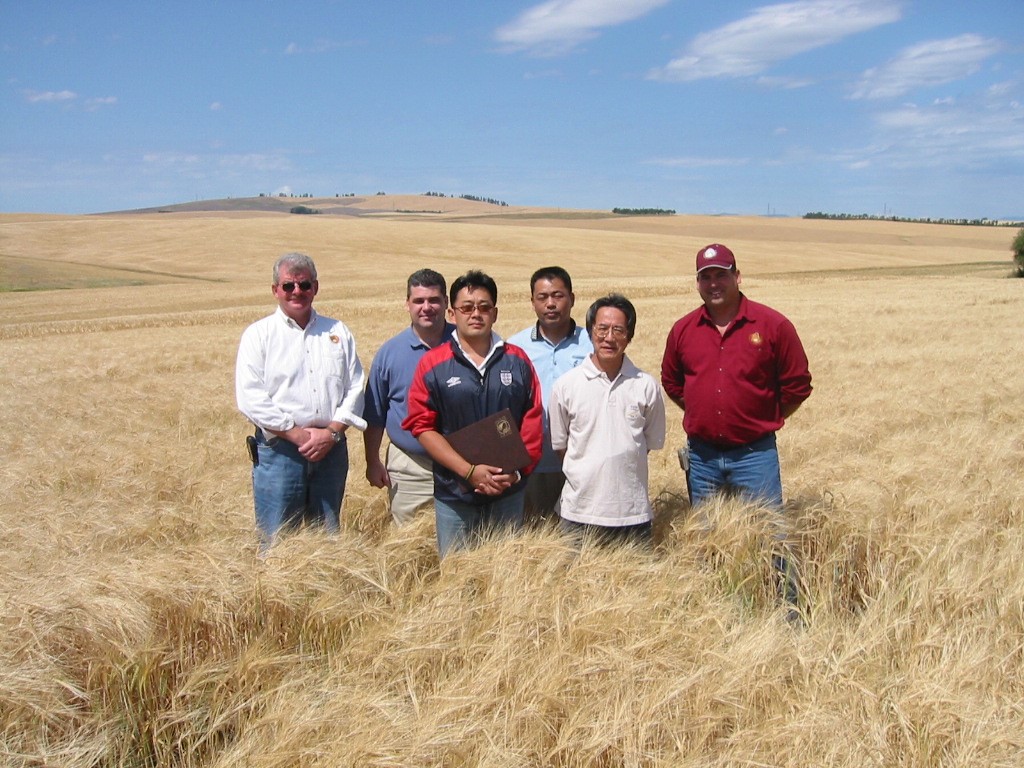 Six People Standing in Field