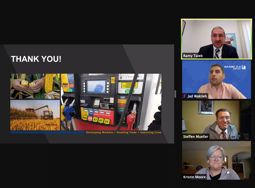 4 People in Online Meeting Next to Presentation