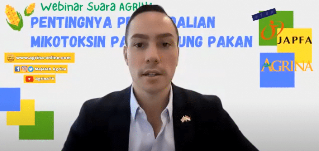 Man in Suit in Front of Text