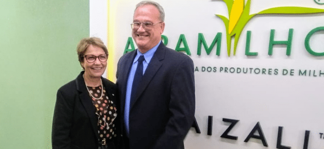 Two People Standing Next to Each Other