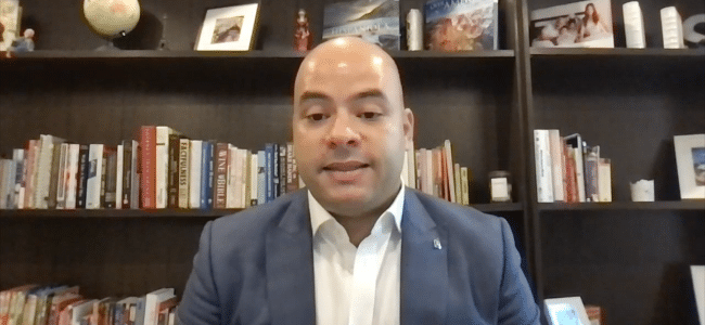 Man on a zoom video meeting call.