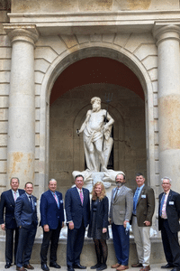 People in front of a statue.