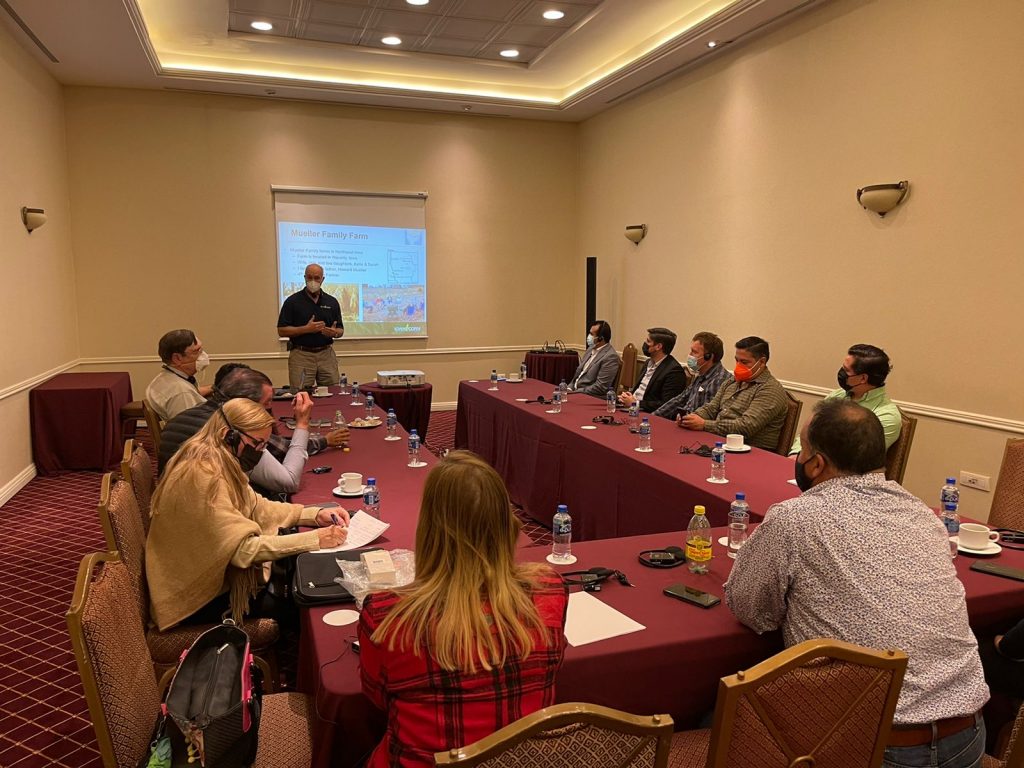 image of a group of people listening to a speaker