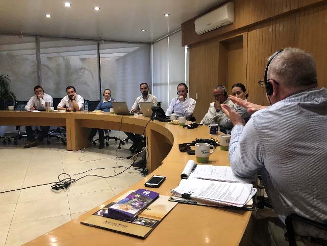 Image of a group of people at a round table