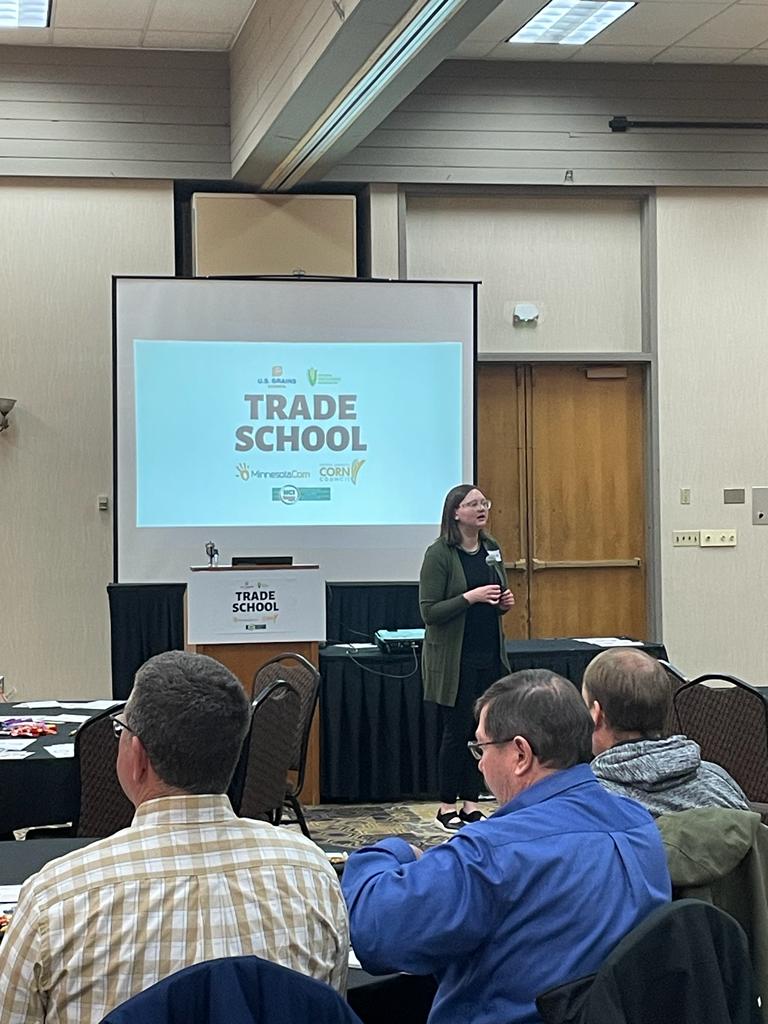 A woman giving a presentation to a crowd