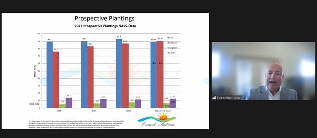 A screenshot of a virtual meeting with a man next to a graph