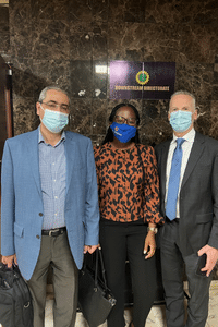 image of two men and a woman wearing masks