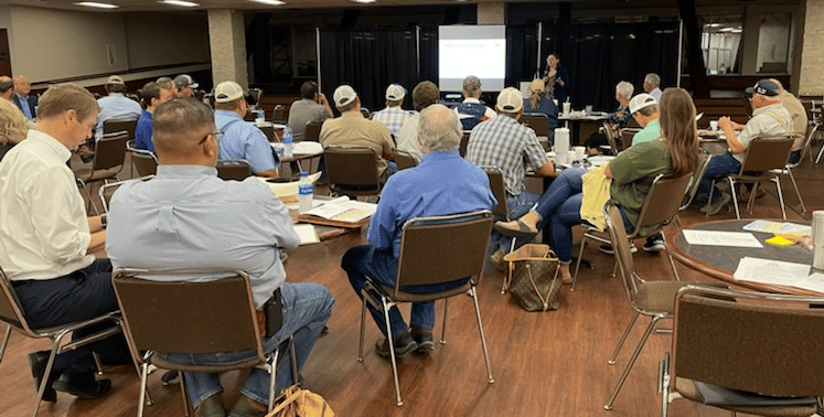 image of people listening to a speaker