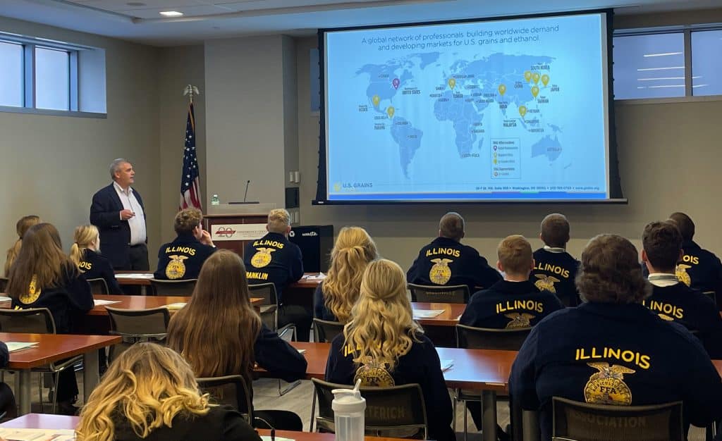 image of man making a presentation to a group of students