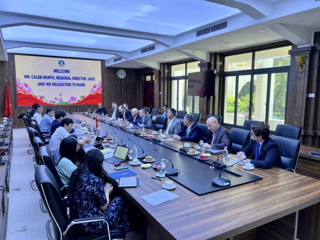 image of people sitting at a conference table