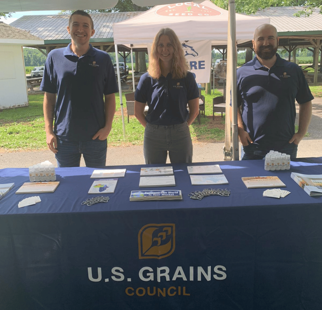 image of two men and a woman smiling for photo