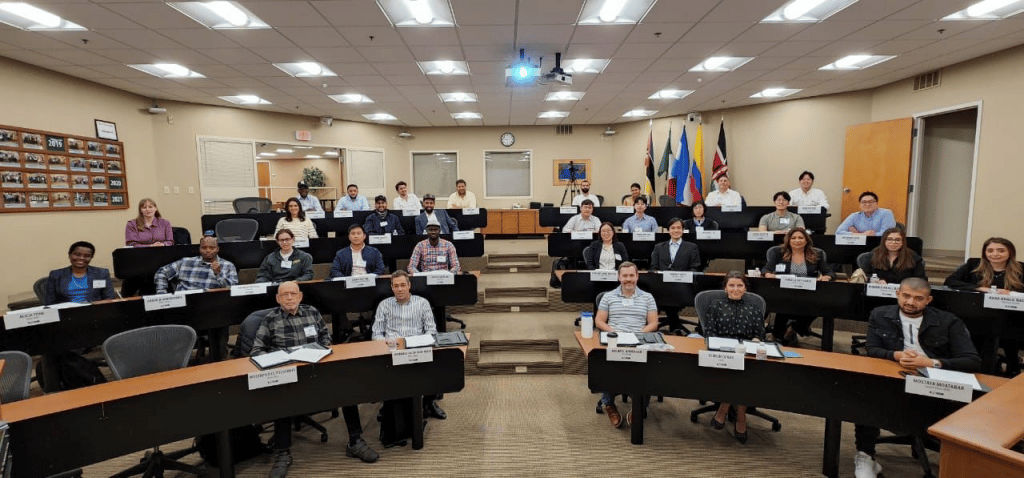 group of people in a classroom smiling