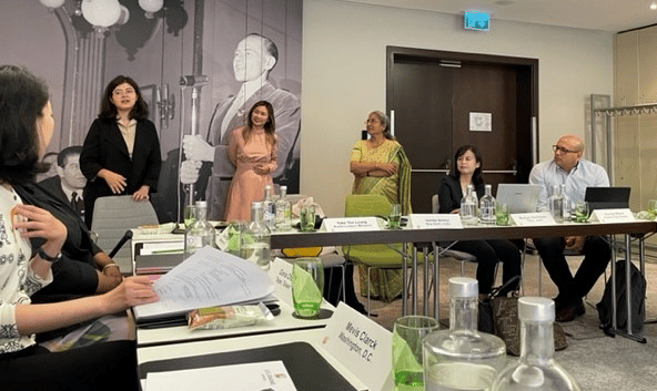 image of people talking at a conference