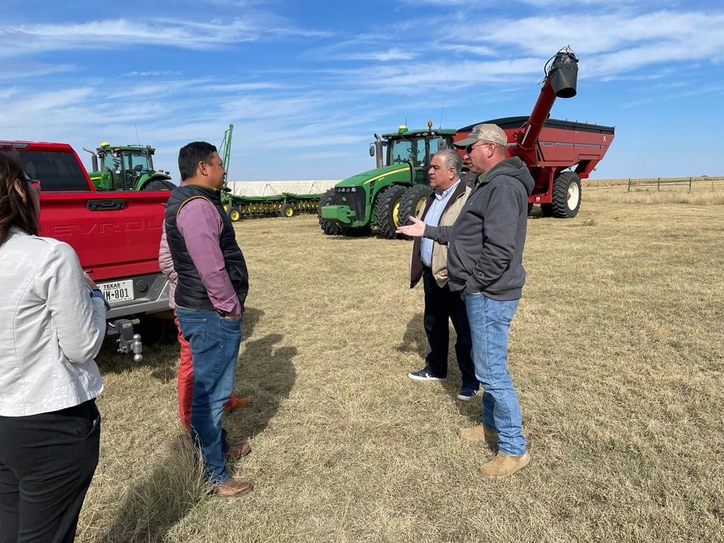 image of people talking on a farm