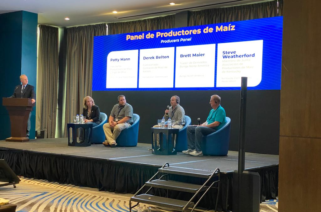 image of four farmers on a panel