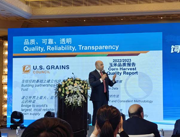 Image of man speaking at conference