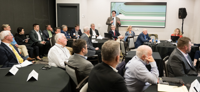 image of man speaking to a room full of people