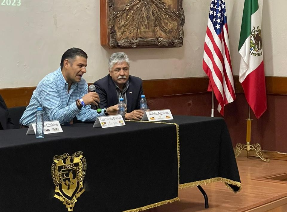 image of two men speaking on a panel