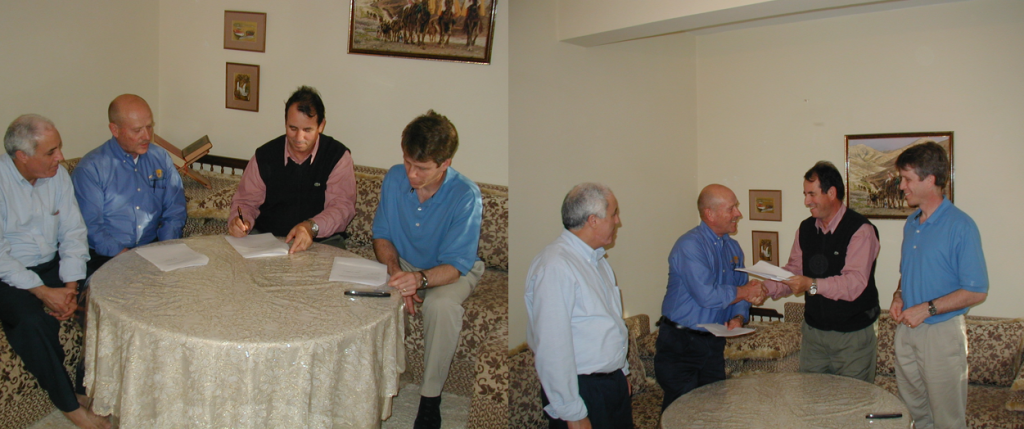 image of people signing a MOU