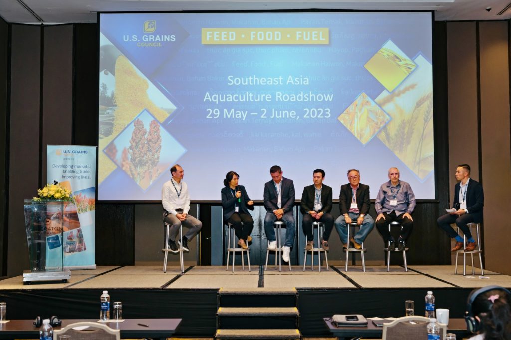 image of people speaking on a panel