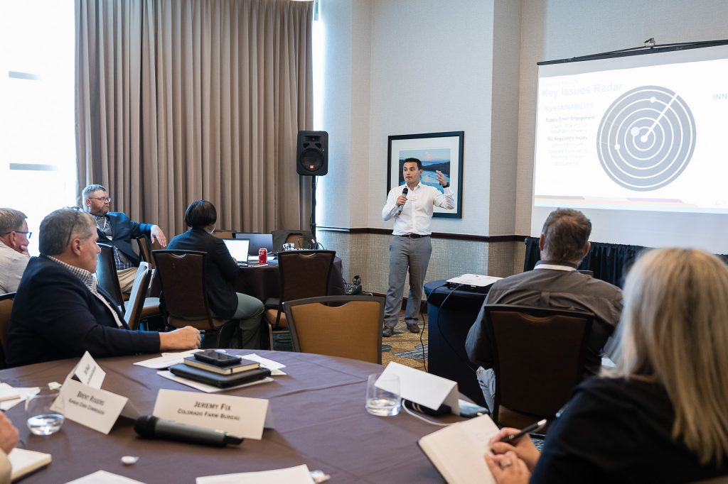 image of man speaking to a room of people