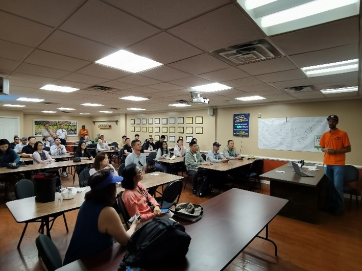 image of people listening to a presentation