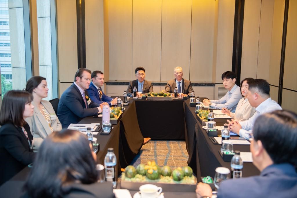 image of people talking around a table in Korea