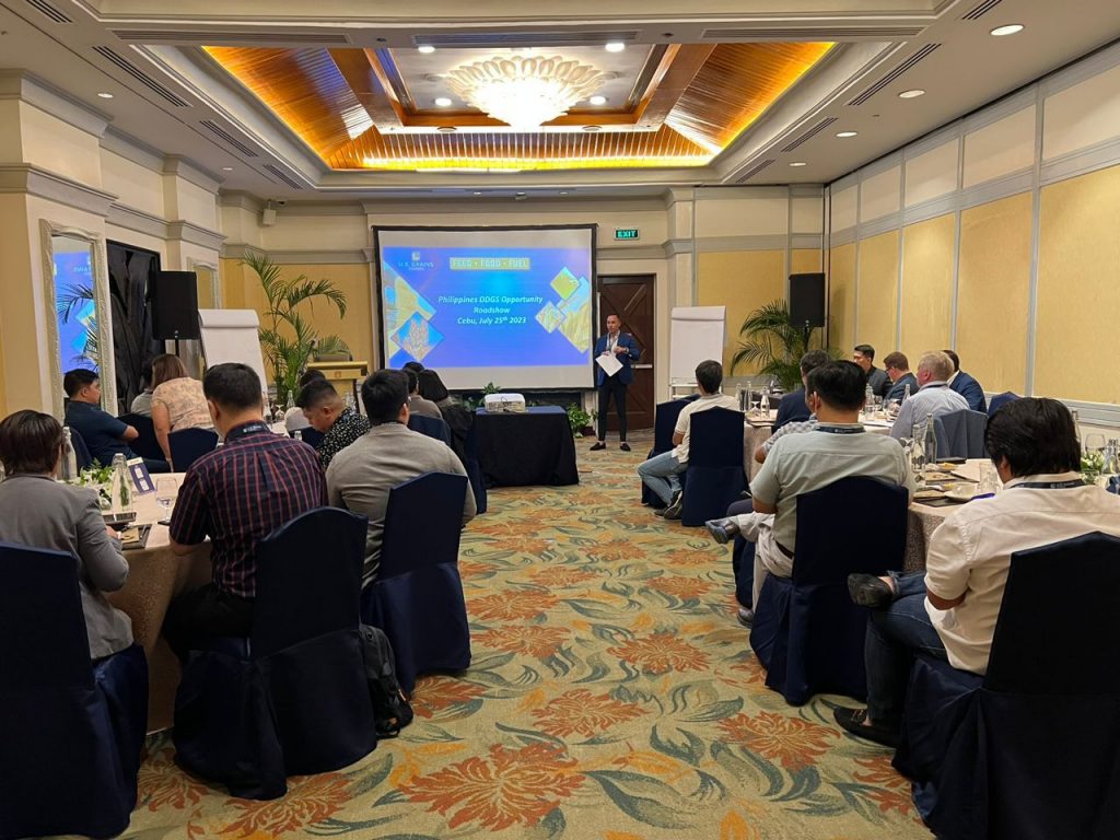 image of man speaking to a room of people