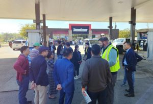 A group of people at a gas station
