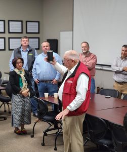 A man speaks to a group of people