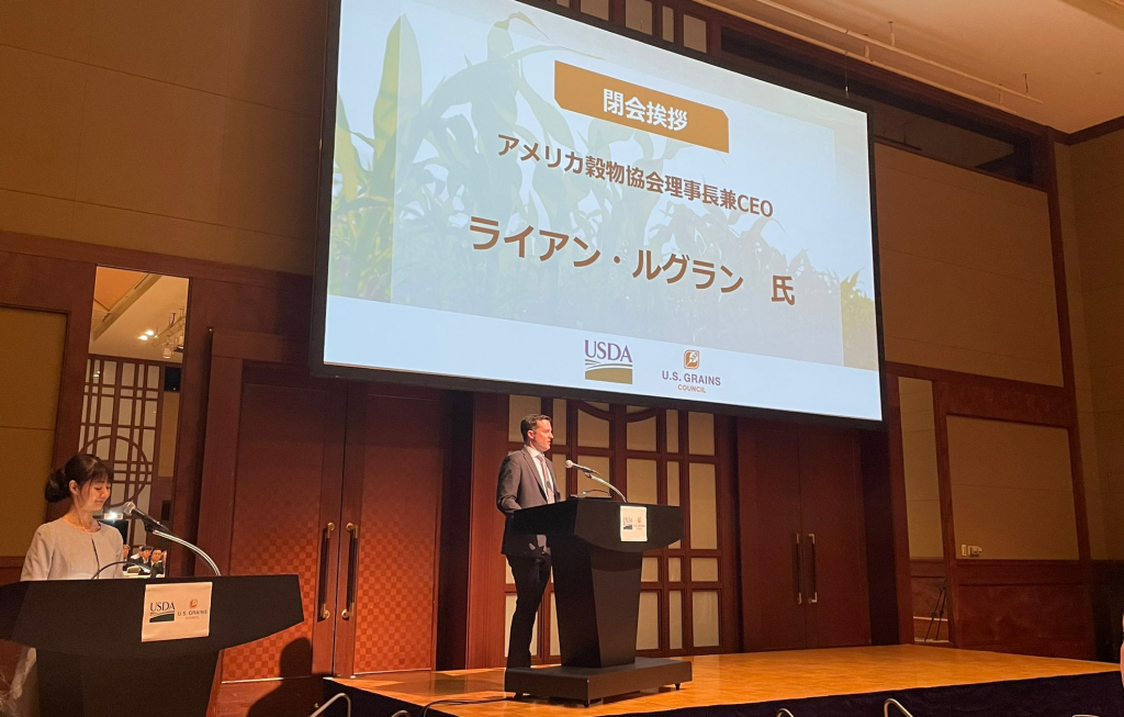 A man speaks at a podium